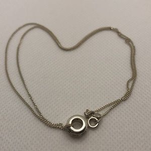 925 Silver necklace and charm. Marked C^A.